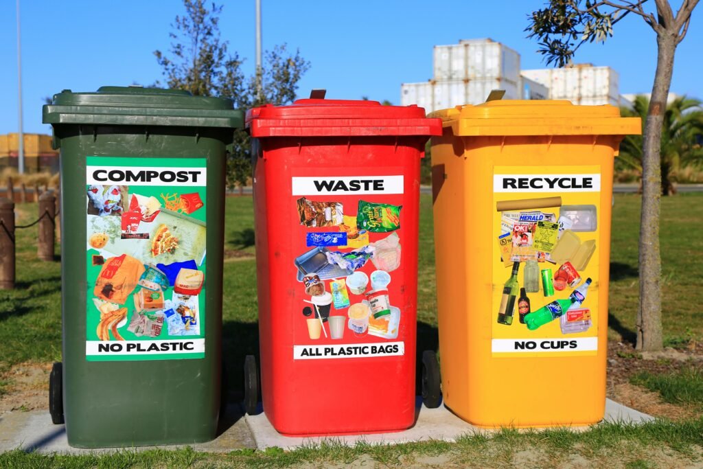 Three bins labeled compost, waste, and recycle, promoting proper waste segregation.